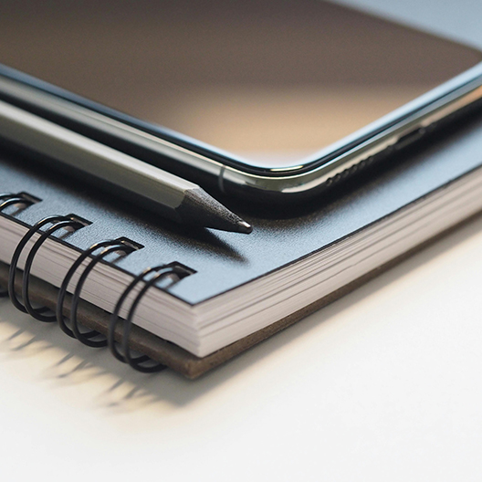 Notebooks and a pencil